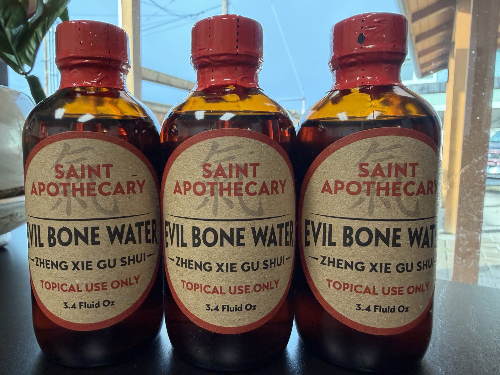 This is three evil bone water bottles, Show the gap at the top of the bottle.