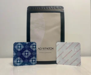 Ao Yi Acupoint Pain Patches package with example patches in front