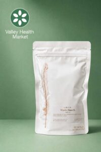 Warm Hearth Tea product mockup with a green background by Valley Health market